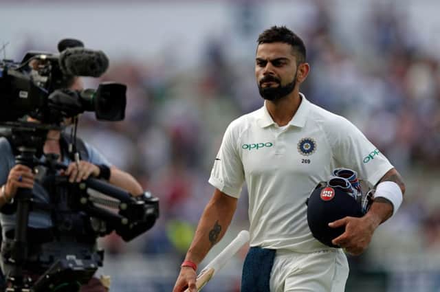 India's Captain Virat Kohli walks off the pitch at the end of play during the third day of the first Test cricket match between England and India at Edgbaston in Birmingham, central England on August 3, 2018. / AFP PHOTO / ADRIAN DENNIS / RESTRICTED TO EDITORIAL USE. NO ASSOCIATION WITH DIRECT COMPETITOR OF SPONSOR, PARTNER, OR SUPPLIER OF THE ECBADRIAN DENNIS/AFP/Getty Images