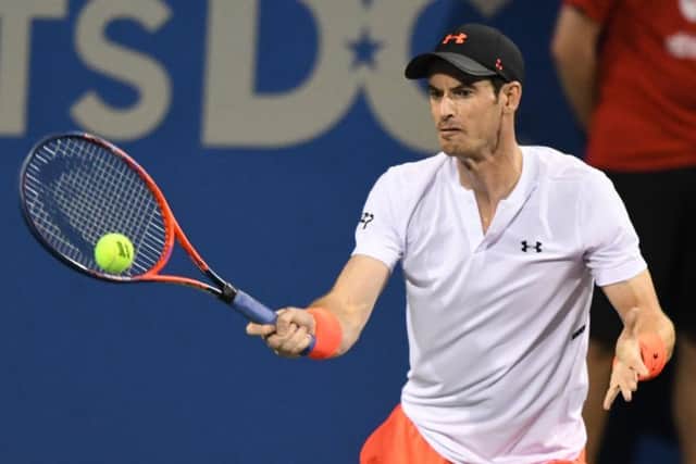 Andy Murray returns a forehand shot to Marius Copil during their Citi Open match. Picture: Getty Images