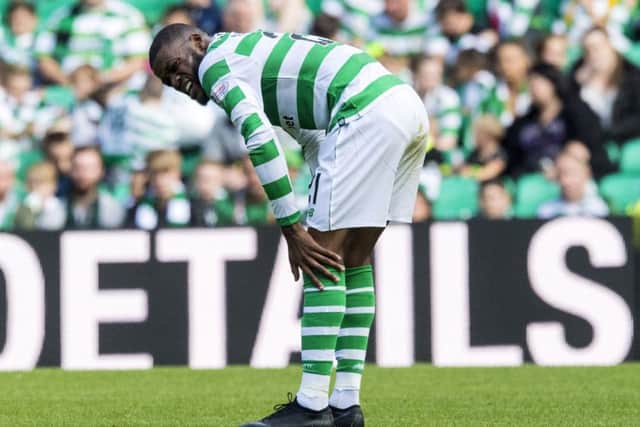 Olivier Ntcham grimaces after hurting his ankle in a challenge with Livingston's Egli Kaja. Picture: SNS Group