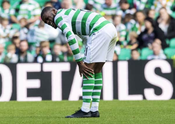Olivier Ntcham grimaces after hurting his ankle in a challenge with Livingston's Egli Kaja. Picture: SNS Group