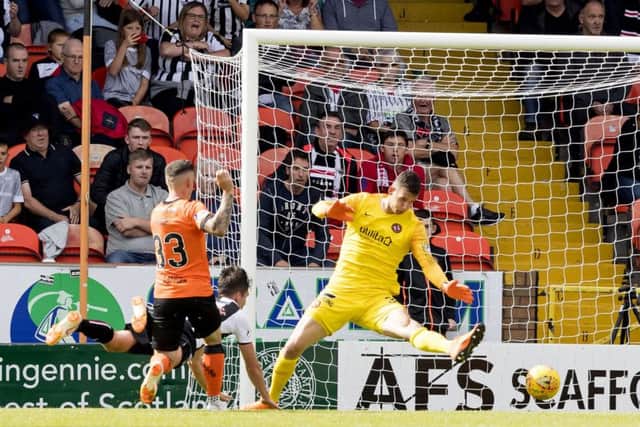 Dunfermline's Jackson Longridge puts his side 2-1 up at Tannadice. Pictures