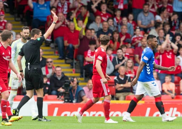 Alfredo Morelos is given his marching orders by referee Kevin Clancy. Picture: PA