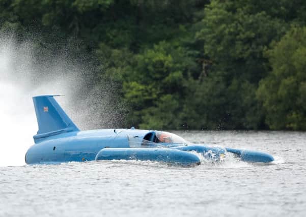 Pilot Ted Walsh fires up the jet engine of Donald Campbell's iconic Bluebird as it propels on the waters of Loch Fad for the first time for 50 years in August last year. Picture: Christopher Furlong/Getty Images