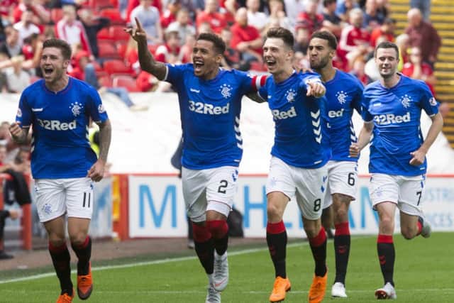 Rangers defender James Tavernier (second left) celebrates after netting from the penalty spot. Picture: PA