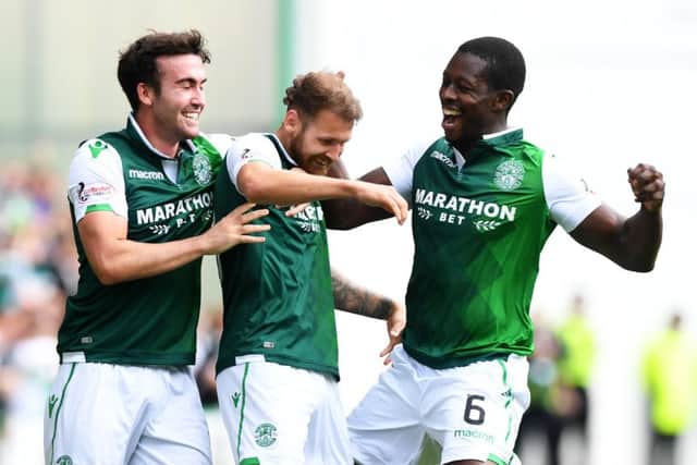 Stevie Mallan and Marvin Bartley celebrate with Martin Boyle (centre). Picture: SNS