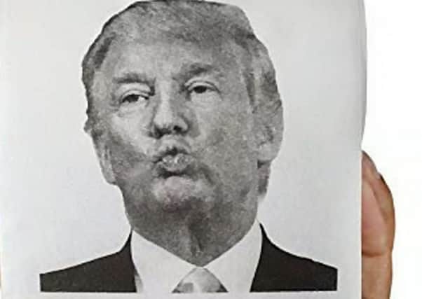 Donald Trump puckers up ready for a kiss in this version of toilet paper on sale at the Edinburgh festival (Picture: SWNS)