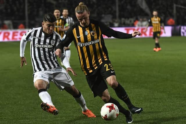 Niklas Hult of AEK Athens holds off PAOK forward Dimitris Limnios during a Greek Superleague match. Picture: Getty Images