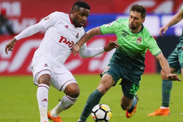 Aleksandr Sukhov of FC Ufa vies for the ball with Lokomotiv Moscow forward Jefferson Farfan in a Russian Premier League match. Picture: Getty Images