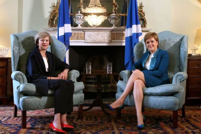 Prime Minister Theresa May (left) meets with Scotland's First Minister Nicola Sturgeon at Bute House in Edinburgh.