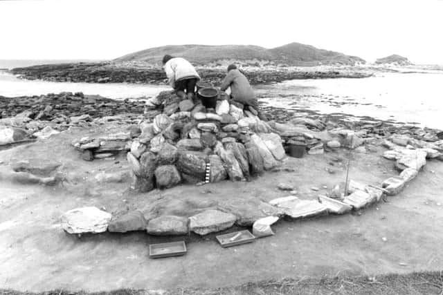 Excavation of Bronze Age Cairn at the Udal, with the cist burial to the immediate left of the cairn. PIC: Copyright Udal Project Archives.