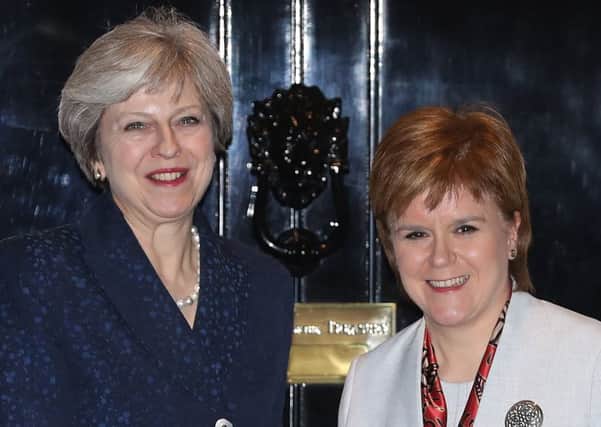 All smiles: Theresa May and Nicola Sturgeon, seen meeting at Downing Street, will hold talks in Edinburgh today about Brexit (Picture: Dan Kitwood/Getty Images)