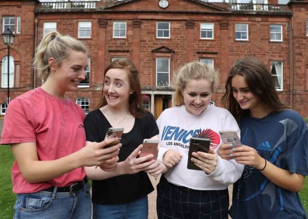 (Left to right) Nicola Bryan, Rebecca Black, Beth MacGinty and Abby Hay awaiting their results to be delivered by text at Kilgraston independent school for girls in Bridge of Earn, Perth. Picture: PA