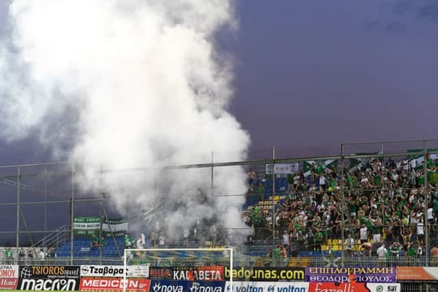 Hibs fans set off flares at the Theodoros Kolokotronis Stadium, incurring UEFA's wrath. Picture: SNS Group