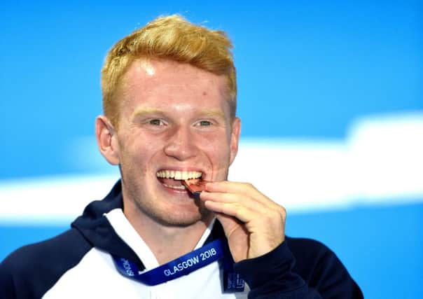 Great Britain's James Heatly celebrates with his bronze medal in the men's 1m springboard final. Picture: Ian Rutherford/PA