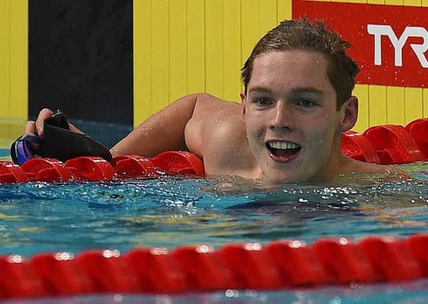 Duncan Scott celebrates taking gold in the 200m freestyle final: Picture AFP/Getty