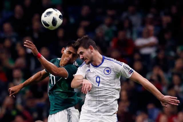 Mexico's Jesus Gallardo challenges Bosnian striker Elvir Koljic during a friendly match in Texas in January 2018. Picture: AFP/Getty Images