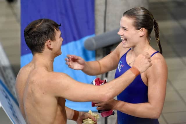 Great Britain's Ross Haslam and Grace Reid embrace after the Synchronised 3m Springboard Mixed Final. They won silver medals. Picture: Ian Rutherford/PA Wire
