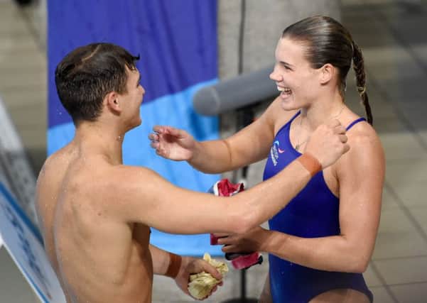 Great Britain's Ross Haslam and Grace Reid embrace after the Synchronised 3m Springboard Mixed Final. They won silver medals. Picture: Ian Rutherford/PA Wire