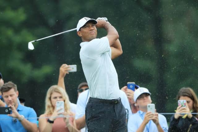 Tiger Woods plays a shot as fans look on during a practice round prior to the PGA Championship at Bellerive Country Club in St Louis. Picture: Sam Greenwood/Getty