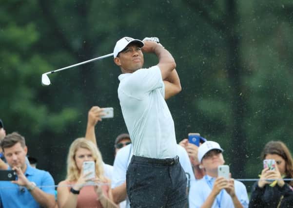 Tiger Woods plays a shot as fans look on during a practice round prior to the PGA Championship at Bellerive Country Club in St Louis. Picture: Sam Greenwood/Getty