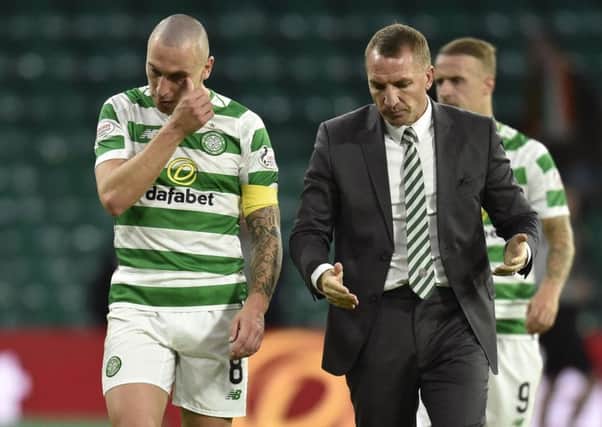 Scott Brown and Brendan Rodgers in discussion at full time. Picture: Rob Casey/SNS