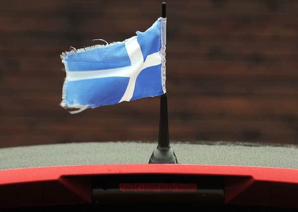 The flag of Shetland flies from the aerial of a car near Lerwick Harbour. Picture: Andy Buchanan/AFP/Getty Images