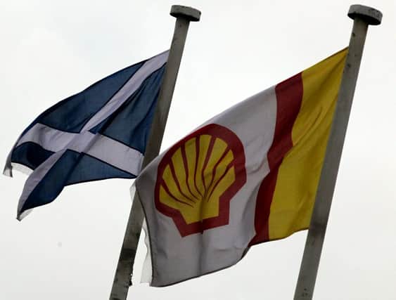 Flags fly outside the Shell Exploration and Production offices in Aberdeen. The company has marked 50 years of production in the North Sea energy sector. Picture: PA