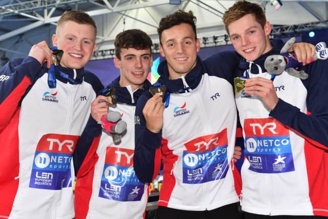 Britain's Adam Peaty, Nicholas Pyle, James Guy and Duncan Scott celebrate their victory in the men's 4x100m medley. Picture: Bill Murray/SNS