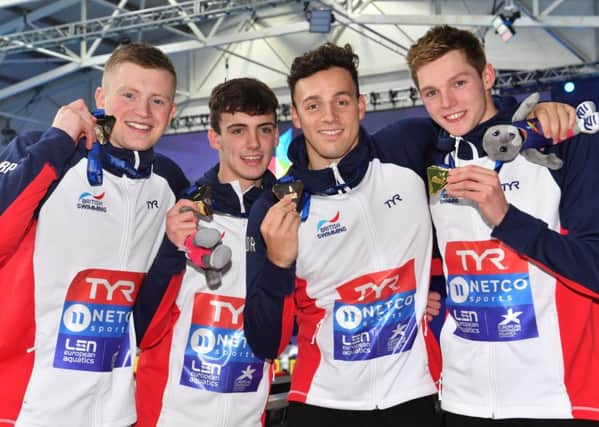 Britain's Adam Peaty, Nicholas Pyle, James Guy and Duncan Scott celebrate their victory in the men's 4x100m medley. Picture: Bill Murray/SNS