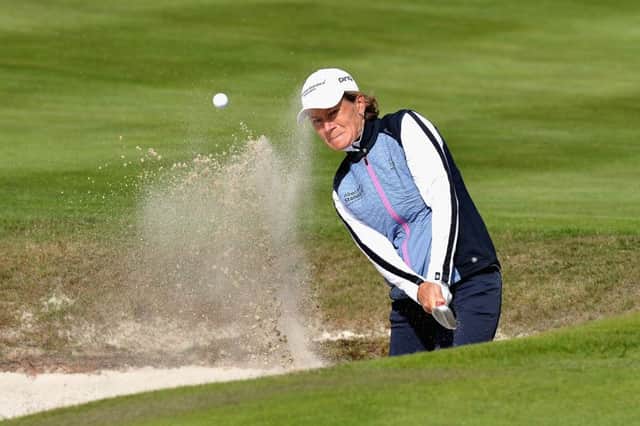 Catriona Matthew plays out of a bunker on the eighth hole on the way victory, with partner Holly Clyburn, at Gleneagles yesterday. Picture: Getty