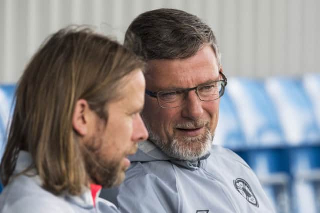 Hearts manager Craig Levein, right, chats with his assistant Austin McPhee during a training session at the Oriam yesterday. Picture: SNS.