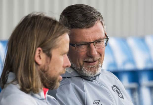 Hearts manager Craig Levein, right, chats with his assistant Austin McPhee during a training session at the Oriam yesterday. Picture: SNS.