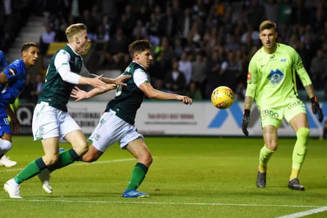 Hibernian's Emerson Hyndman watches as the ball goes wide after his initial effort was blocked in stoppage time. Picture: SNS