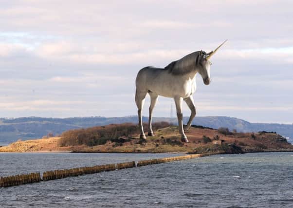 A composite image showing what a large statue of a unicorn on Cramond Island in the Firth of Forth might look like