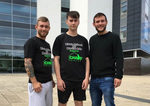 Motherwell kickboxer Jordan McCafferty with Knockout the Stigma organisers Scott (left) and Sam Allan
