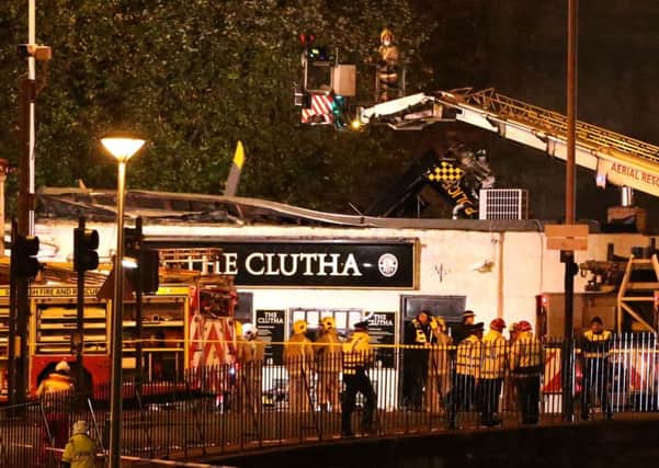 Police and Scottish Fire and Rescue services at the scene of a helicopter crash at the Clutha Bar in Glasgow in 2013. Picture: Andrew Milligan/PA Wire