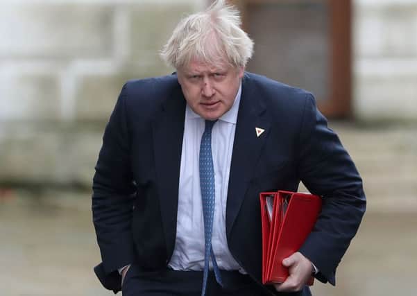 (FILES) In this file photo taken on March 07, 2018 Britain's then Foreign Secretary Boris Johnson arrives in Downing Street in London.
Britain's Conservative Party Chairman Brandon Lewis said on August 7, 2018 he had asked former foreign secretary Boris Johnson to apologise for disparaging comments he made about Muslim women wearing burqas. / AFP PHOTO / Daniel LEAL-OLIVASDANIEL LEAL-OLIVAS/AFP/Getty Images