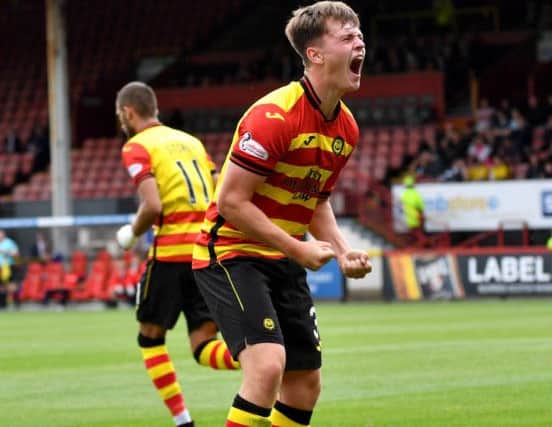 Partick Thistle's James Penrice celebrates putting his side in front. Picture: SNS