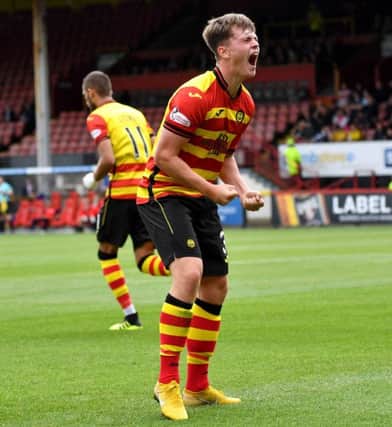 Partick Thistle's James Penrice celebrates putting his side in front. Picture: SNS