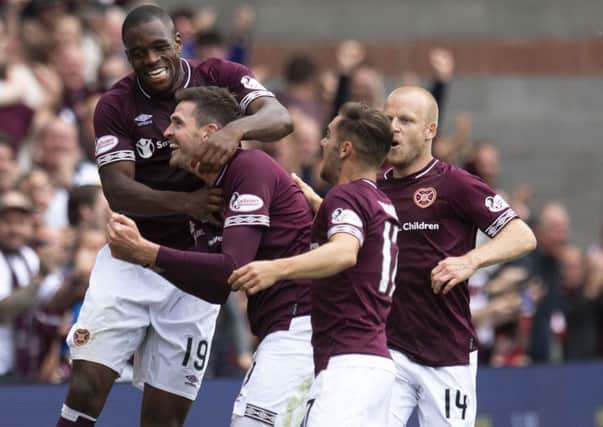 Hearts players celebrate Kyle Lafferty's goal. Picture: SNS