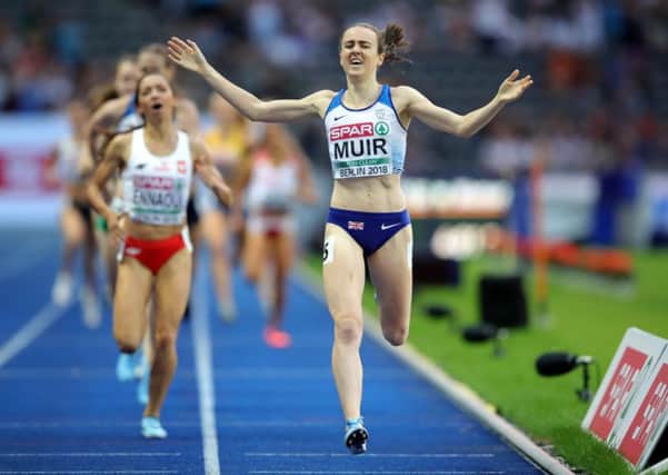 Laura Muir celebrates as she crosses the line to win the gold medal in the Women's 1,500m final. Picture: Getty