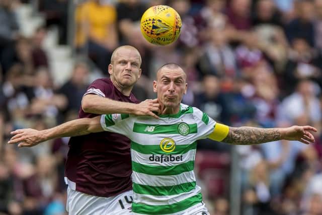 Steven Naismith and Celtic's Scott Brown battle for possession during Hearts' victory at Tynecastle. Picture: PA