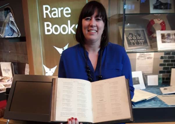 Casssie Kennedy with the historically significant Burns book she found in a charity shop