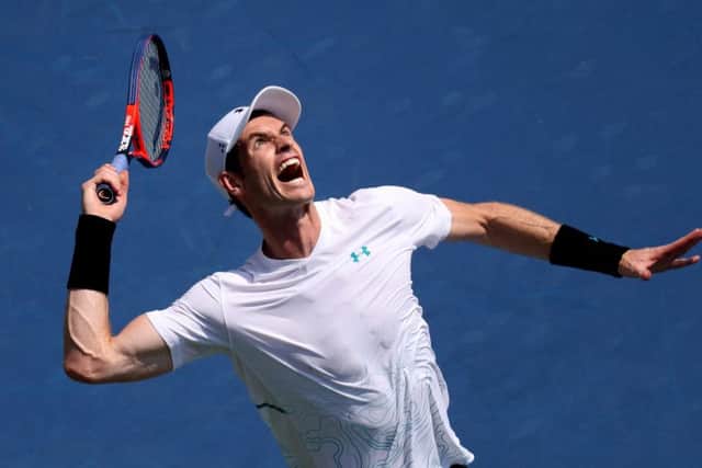 Andy Murray  serves in the second set against Lucas Pouille in Cincinnati last night. Picture: Getty.