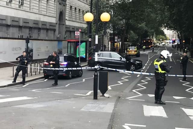 Police activity on Millbank, in central London, after a car crashed into security barriers outside the Houses of Parliament. Picture; PA