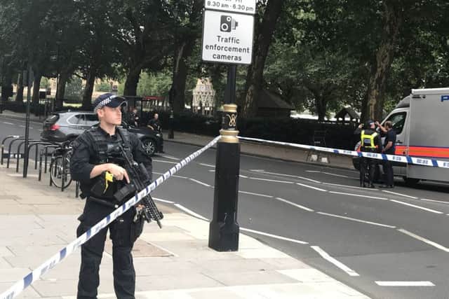 Police activity on Millbank, in central London, after a car crashed into security barriers outside the Houses of Parliament. Picture: Sam Lister/PA Wire