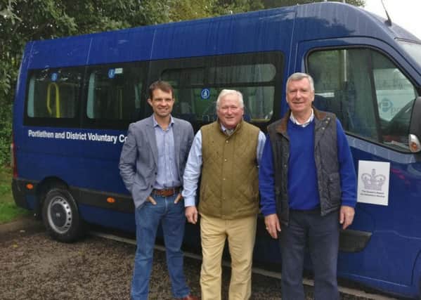 Pictured (from left) are Andrew Bowie, Councillor Colin Pike and ambulance chairman Colin Stratton.