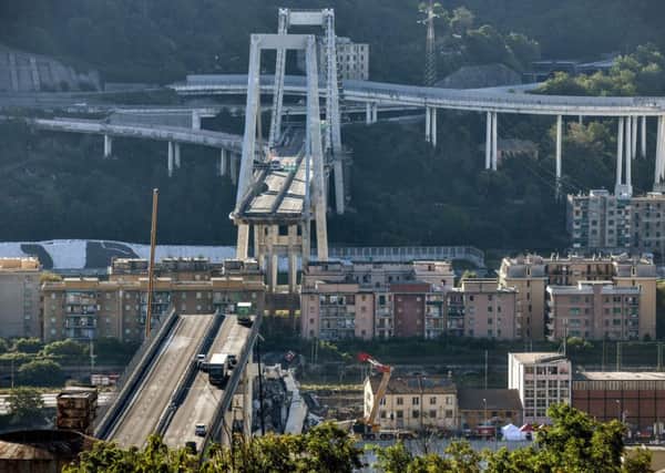 The collapse, which saw a vast stretch of the A10 freeway tumble on to railway lines in the northern port city, was the deadliest bridge failure in Italy for years, and the country's deputy transport minister warned the death toll could climb further. Picture: AFP/Getty