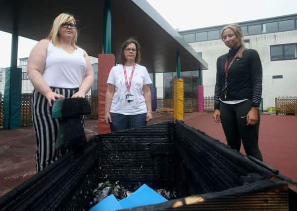 St Rose of Lima Primary School teachers from left, Emma Laing, Nicola Miller and Lorraine Izzett in the sensory garden with the vandalised box. Picture: SWNS