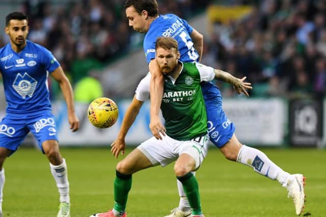 Martin Boyle tussles with Moldes Vegard Forren in the first leg. The winger has been in superb form for Hibs this season. Picture: SNS.